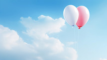 two love baloons in the sky with clouds