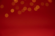 Border of unfocused lights on a red background with copy space