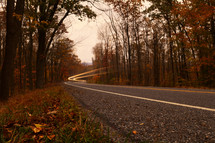 streaks from headlights on an autumn highway 