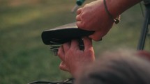 Bicycle repair and maintenance, man fixing a vintage bike seat	
