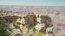 Grand Canyon, Arizona - Tourists crowd an overlook on Mather Point tourist stop in the South Rim of the Grand Canyon National Park.