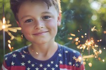 A boy holding sparkles on Fourth of July