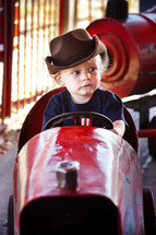 toddler boy on carnival ride 