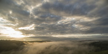 A New morning with a sunrise over a foggy nordic landscape, 