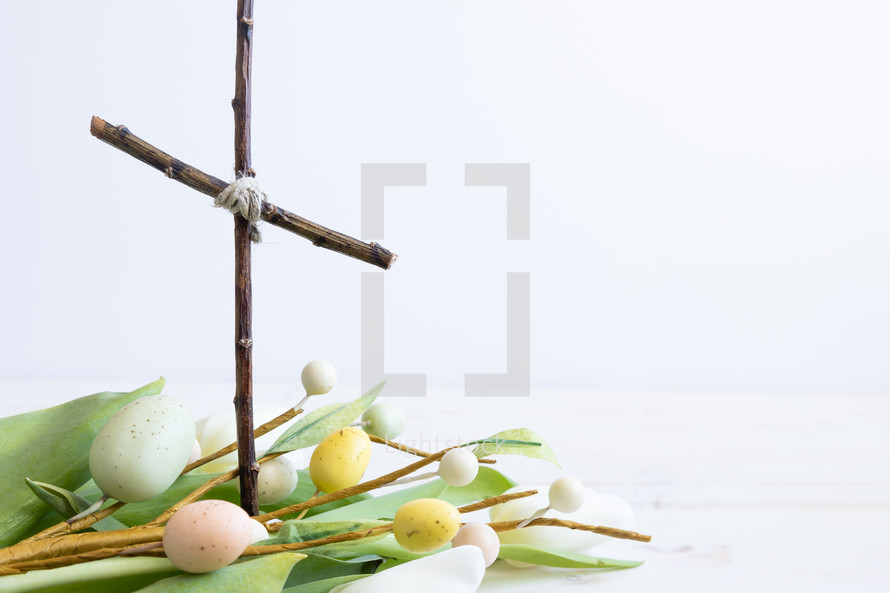 cross of sticks and Easter eggs branches 