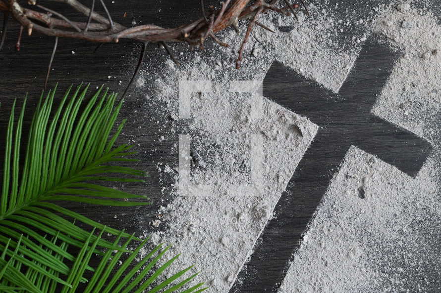 Ashes cross with crown of thorns and palm leaves