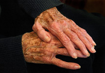 elderly hands at rest, color version