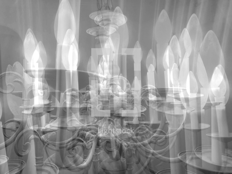 multiple exposure of a chandelier in  light black and white