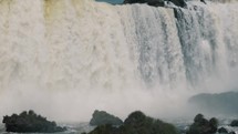Close Up Of Water Falling From The Iguazu Falls At The Border Between Argentina And Brazil.