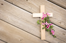 wooden cross with pink flowers 
