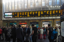 LONDON, UK - CIRCA SEPTEMBER 2019: Travellers at King's Cross railway station