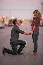 Man proposing on one knees
