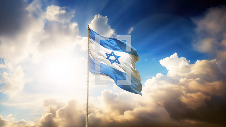 Israel flag fluttering in the wind on a hill at sunrise. God rays and clouds after storm. Victory concept