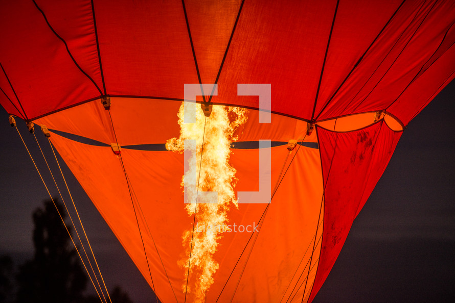 flames filling a hot air balloon 