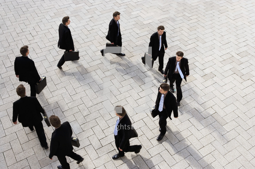 High view of a businessman walking round in circles