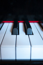 Sharp, flat, and natural piano keys close-up vertical
