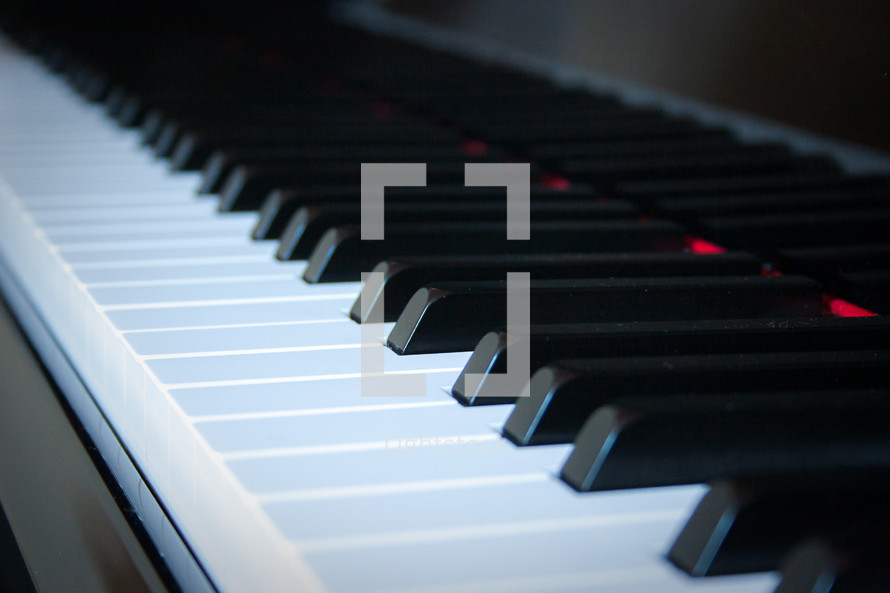 Low perspective of piano keys close-up horizontal