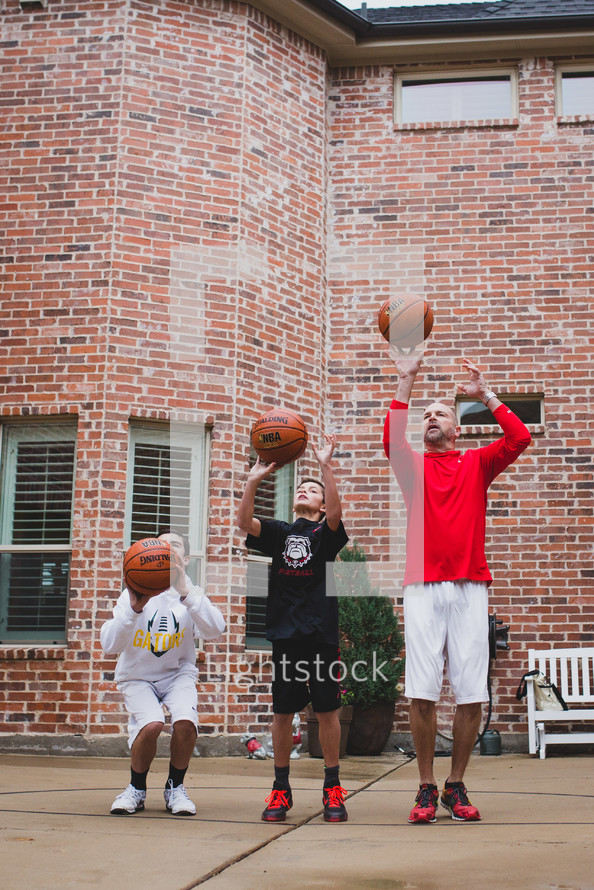 father and son's playing basketball 