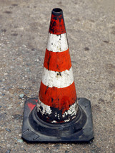Traffic cone for road works with red and white stripes