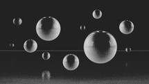 White spheres on black