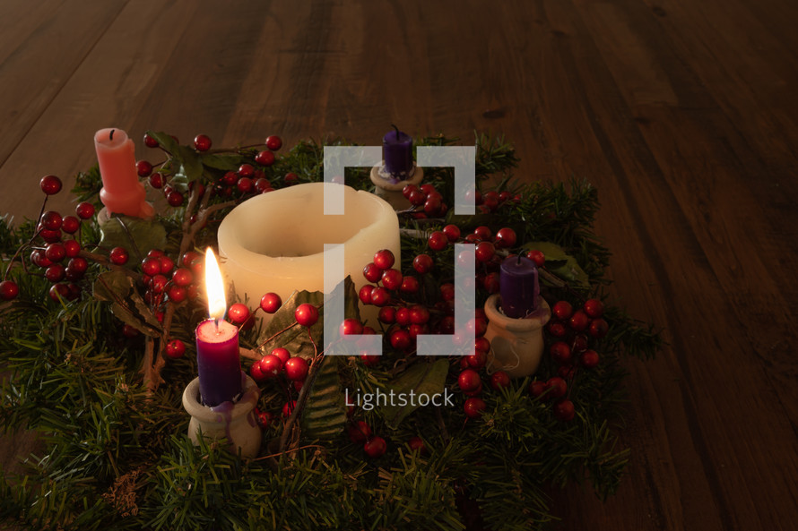 one, 1, advent candles in an advent wreath 