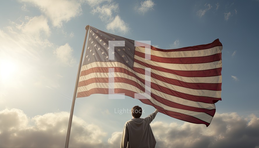 Rear view of man waving american flag against blue sky with clouds