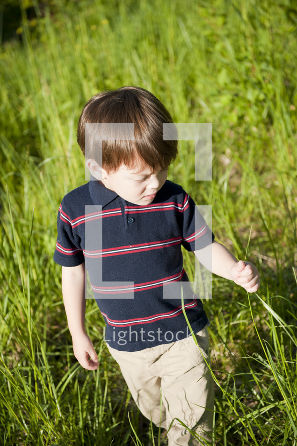 young boy fields of grass