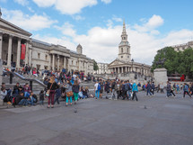 LONDON, UK - JUNE 09, 2015: Tourists visiting Trafalgar Square in front of the National Gallery