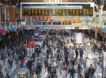 LONDON, UK - SEPTEMBER 28, 2015: Travellers at Liverpool Street Station multi exposure time lapse