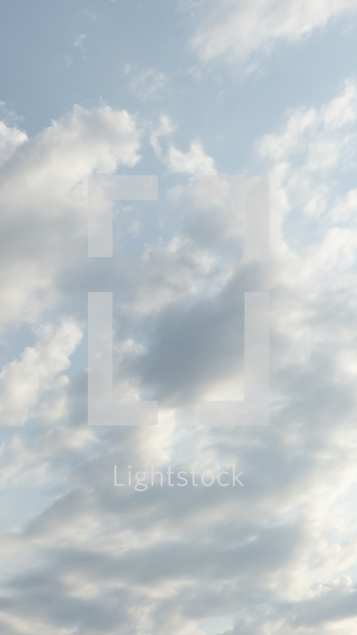 soft, side-lit clouds in vertical format