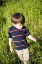 young boy fields of grass