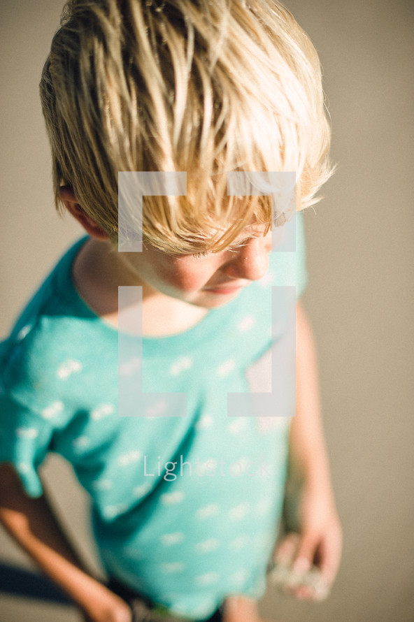 blonde boy child on a beach 