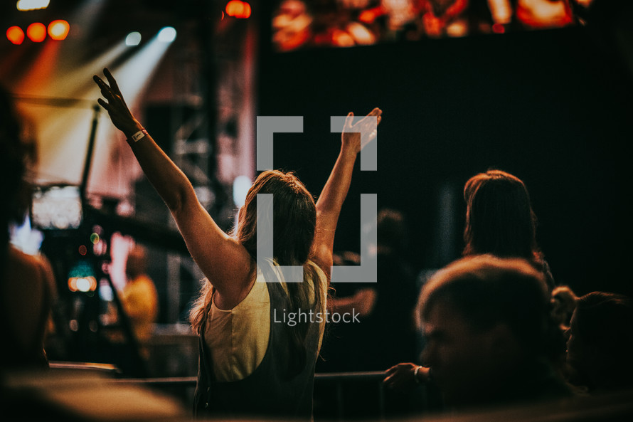 raised hands at a concert in Prague 