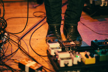 foot on guitar pedals 