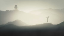 Person Meditating on the Mountains of Japan with Japanese Pagoda