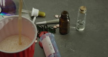 Pouring malt liquor beer into party cup around other illegal drugs - Sin