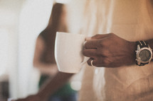 man holding a coffee mug