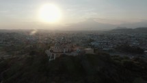Circling shot of Cholula Puebla Mexico Volcano Cathedral Aerial Footage Popocatapetl	