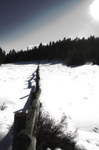 snow and a fence line