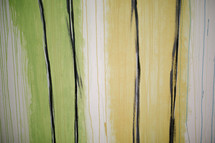 yellow, green, white, black, vertical stripes painted wood background 