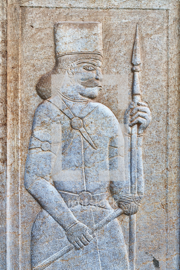 the bas relief of an antique warrior