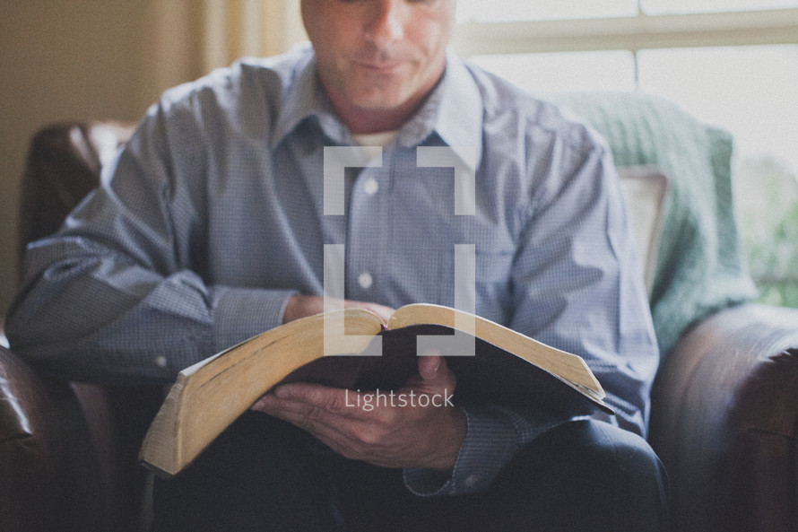 Man reading the bible.