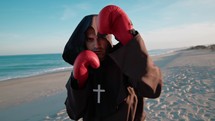 Christian Monk Holding Guard Doing Boxe Workout