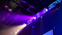 Colorful automated stage lights at a concert venue
