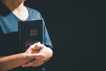 Person holding a bible