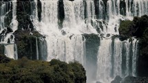 Iguazu Falls With Staircase Character Flowing Down The River In Brazil. - wide shot