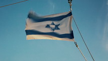 Flag of Israel on the Sea of Galilee.
