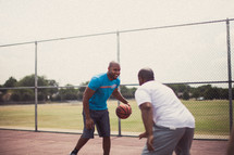 Men playing basketball.