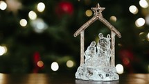 Glass nativity decoration with slowly changing light