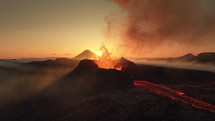 Fagradalsfjall volcano eruption Iceland 2023 aerial view of crater spitting lava at sunrise